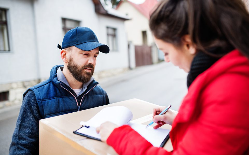 Delivery driver with customer signing VAT form